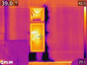EIFS moisture intrusion suspected on thermal image near window opening (infrared camera scan)